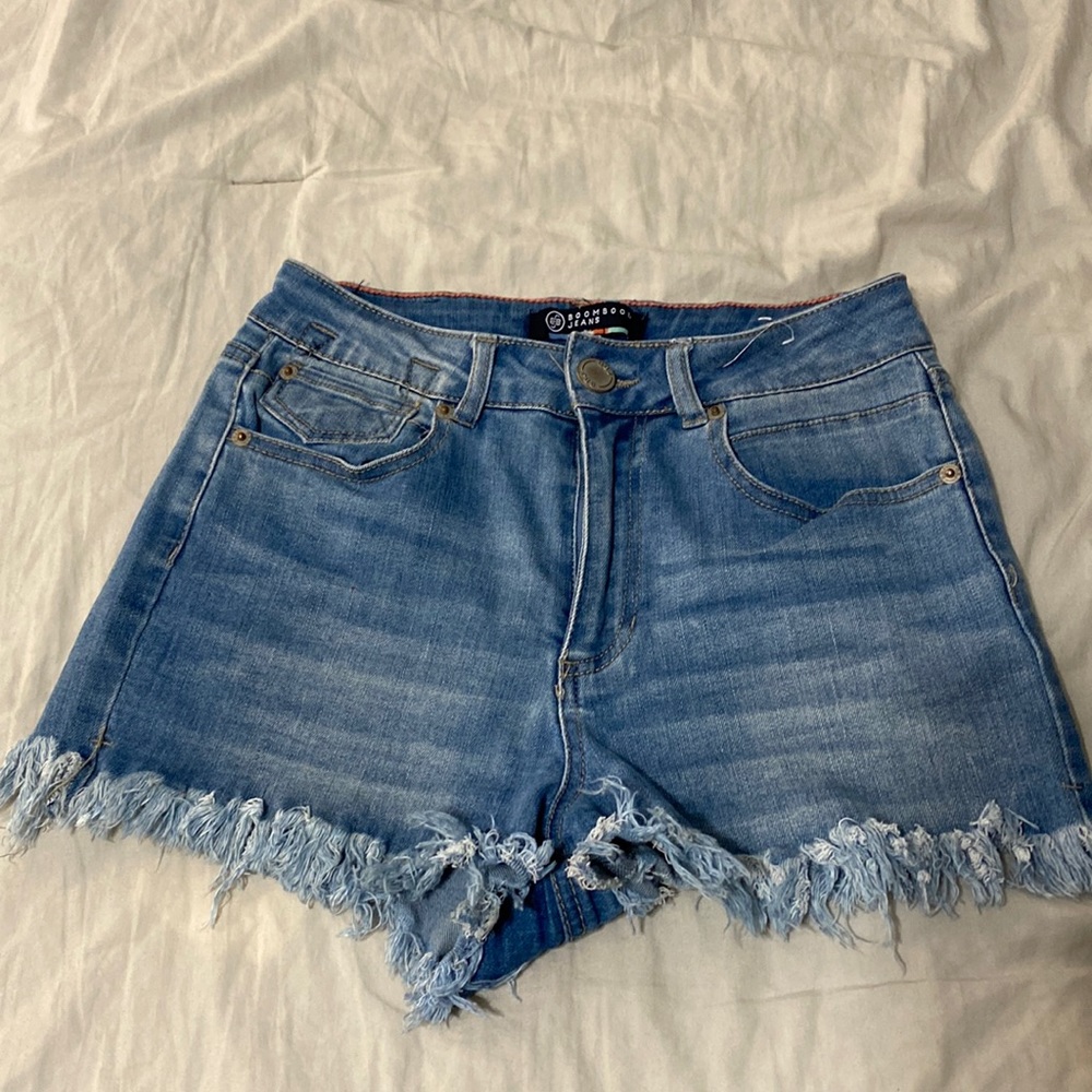 Blue distressed jean shorts. Size 7 fits more like a 5 super stretchy.